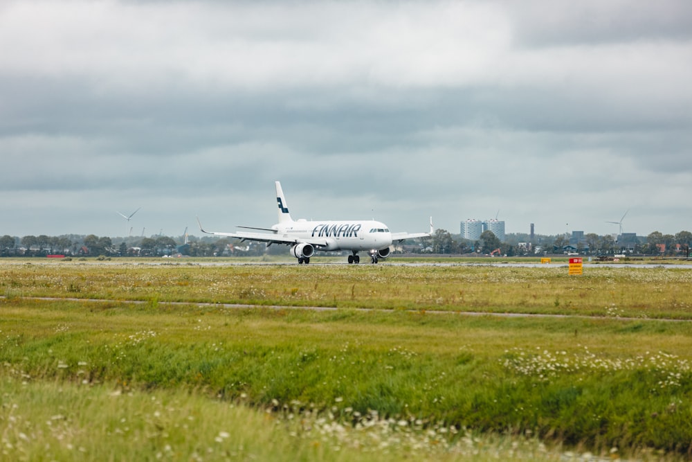 a large jetliner sitting on top of an airport runway