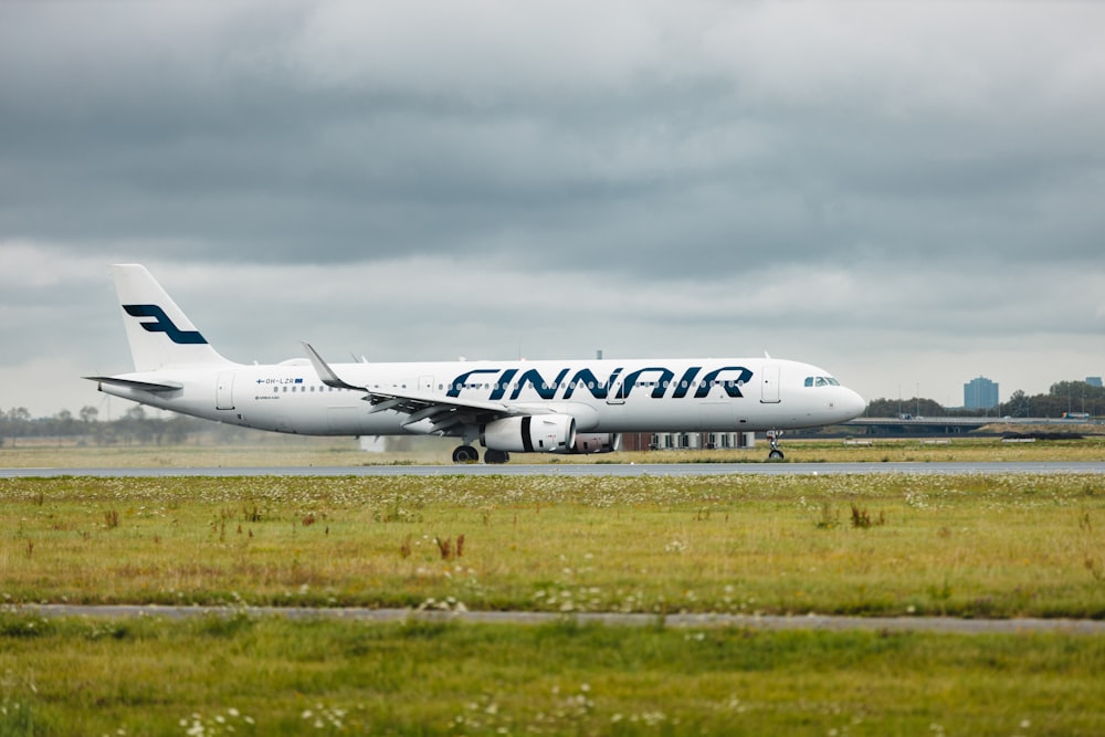 a large jetliner sitting on top of an airport runway