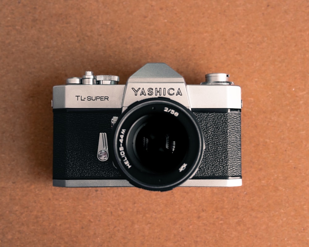 a camera sitting on top of a brown table