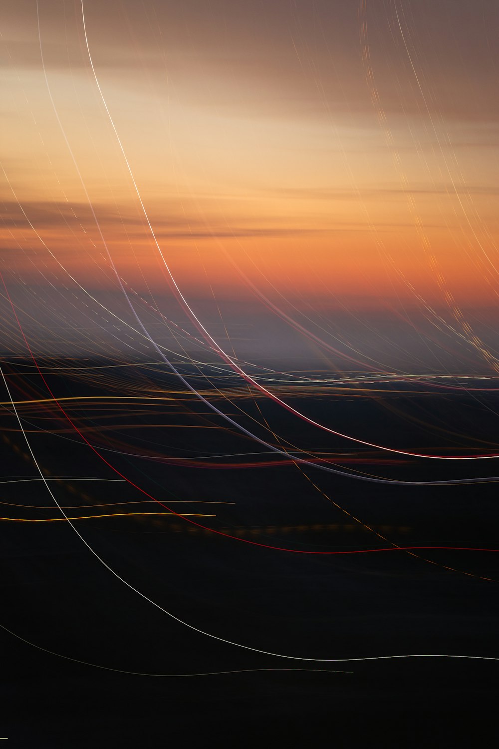 a photo of a sunset with lines in the sky
