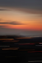 A blurred background of a city skyline at dusk, hinting at potential growth and new beginnings.