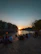 Guests enjoying a serene sunset view by the riverside at the cottage.