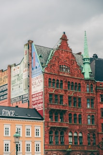 a red brick building with many signs on it