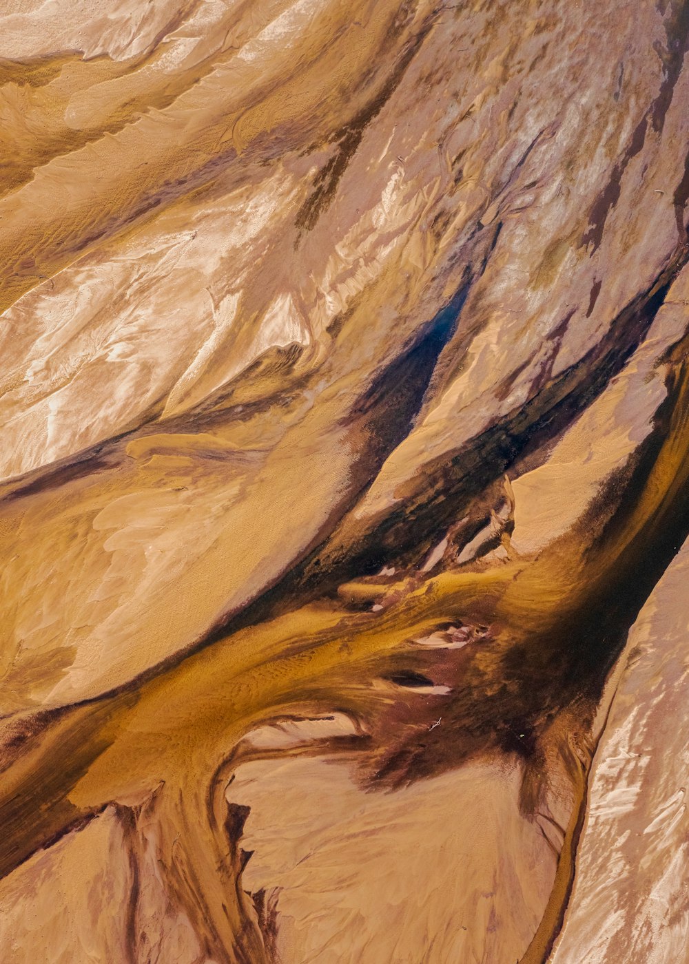 an aerial view of a mountain with a river running through it