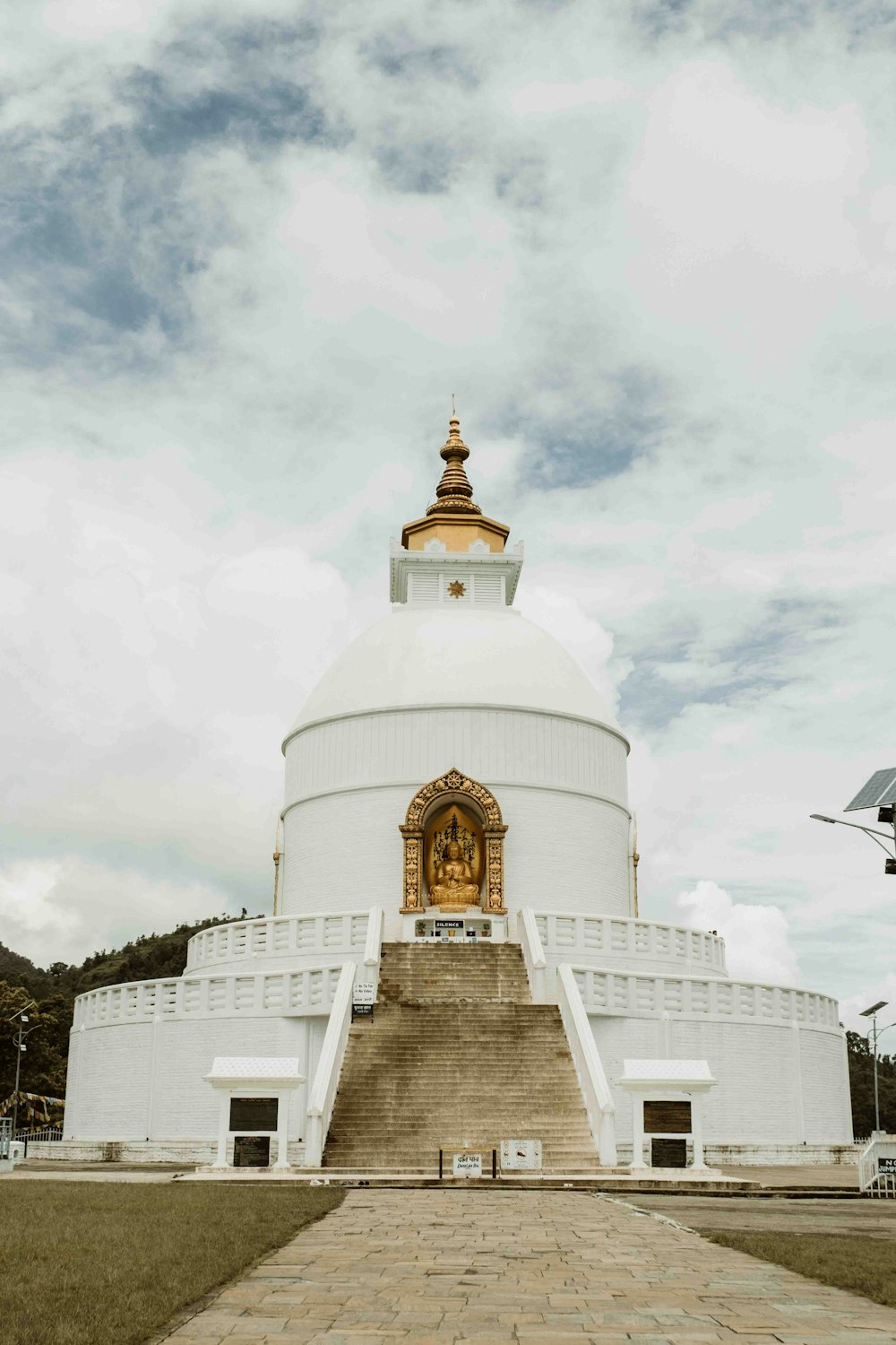 a large white building with a golden dome