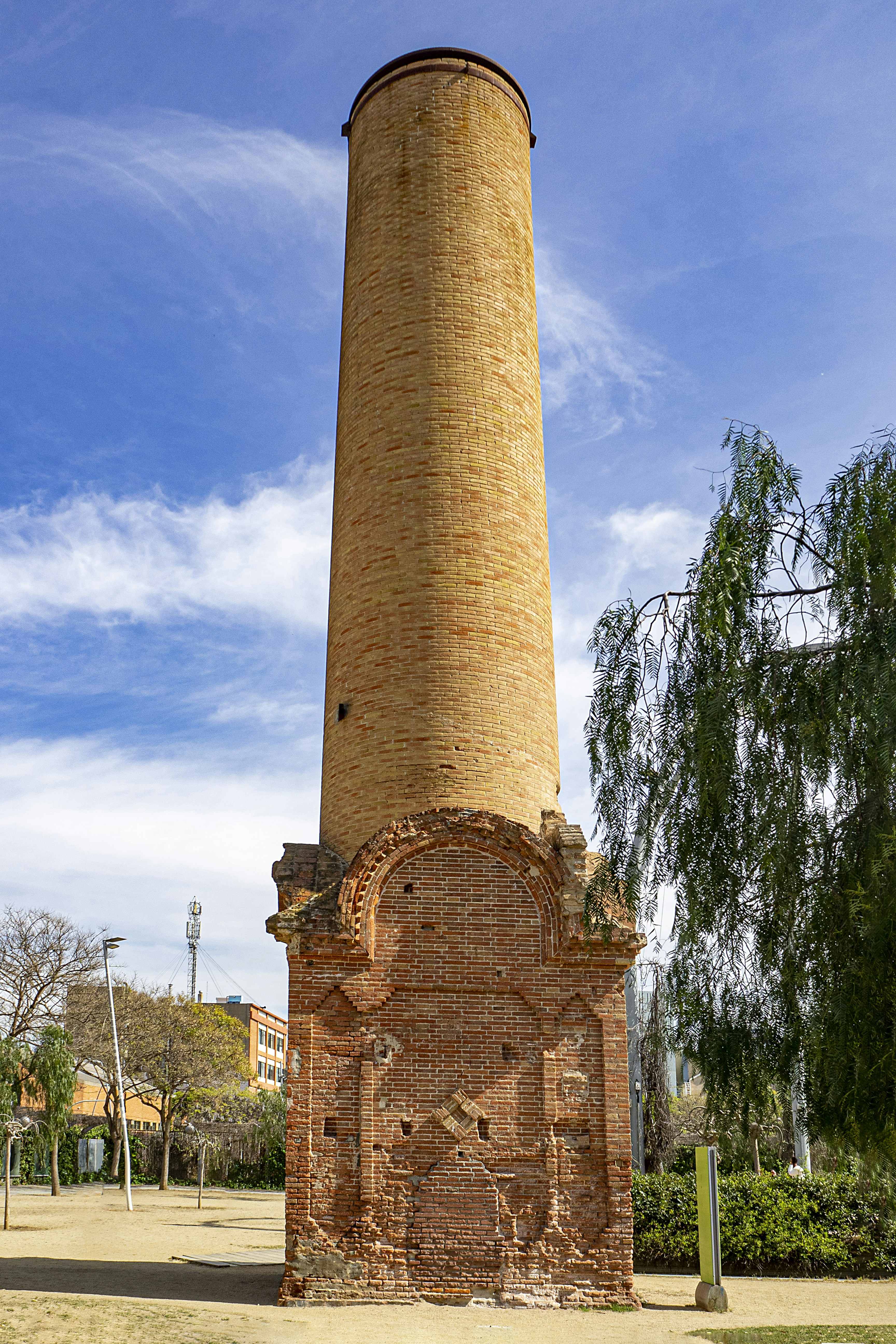a tall brick tower with a clock on it