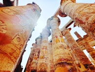 Ancient hieroglyphics carved into temple walls glowing in golden light.