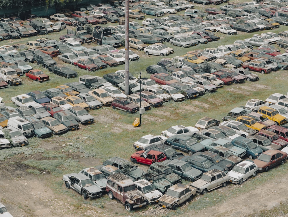 a parking lot filled with lots of old trucks