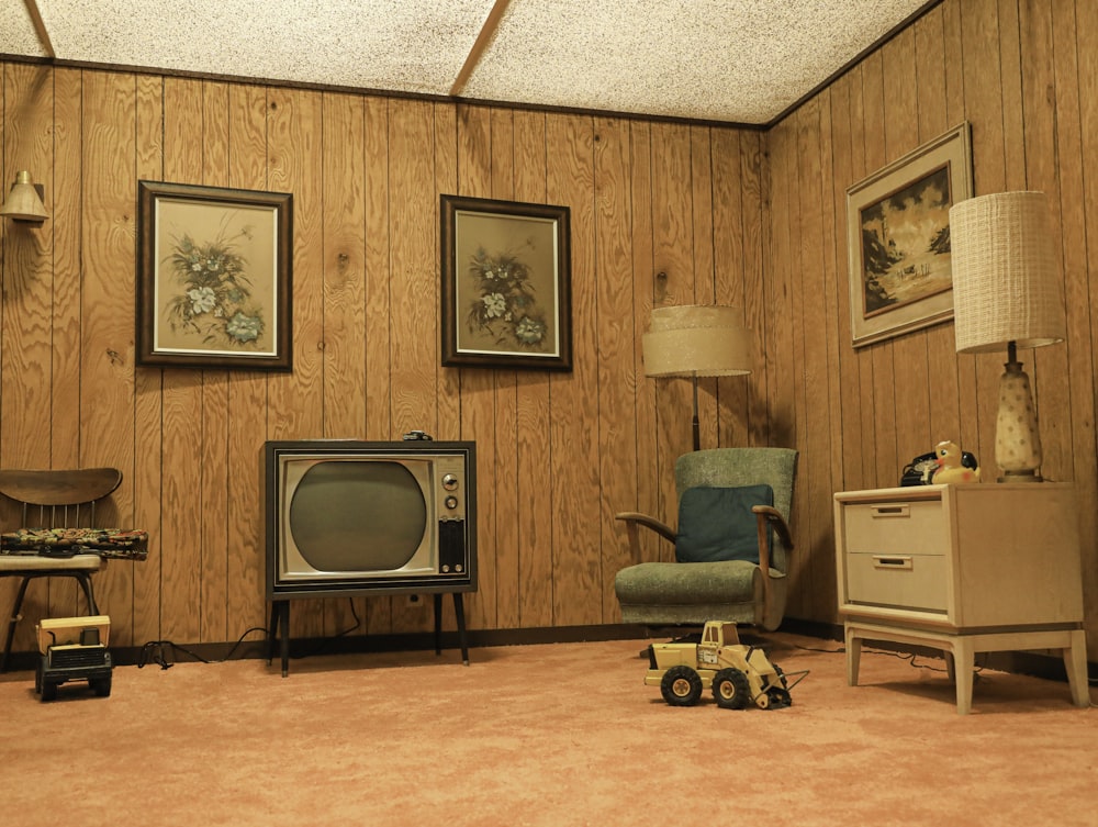 a living room with a television and a toy car