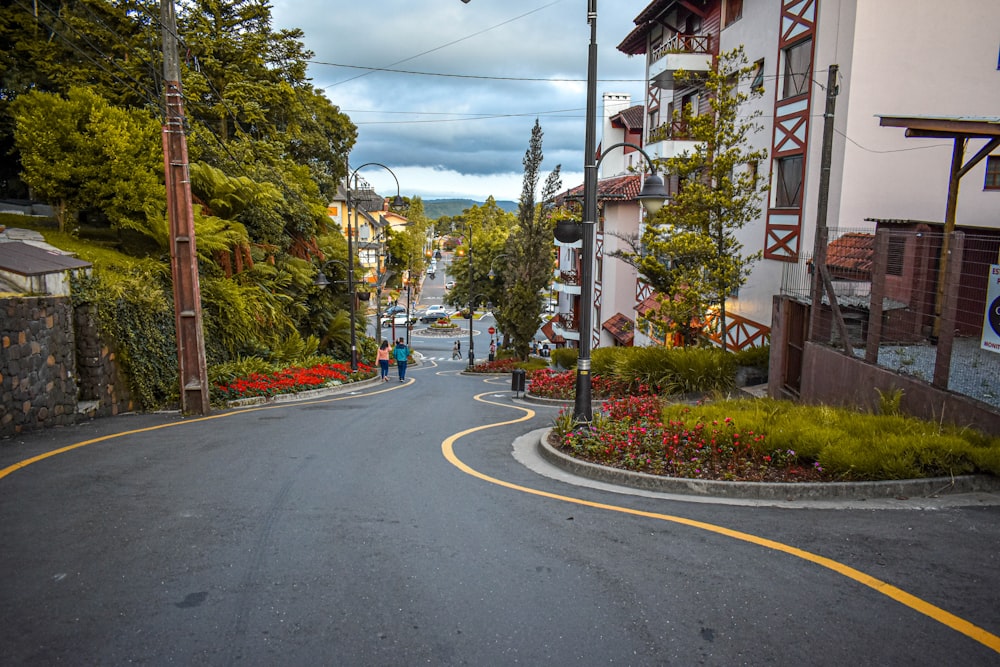 a person is walking down a street in a small town