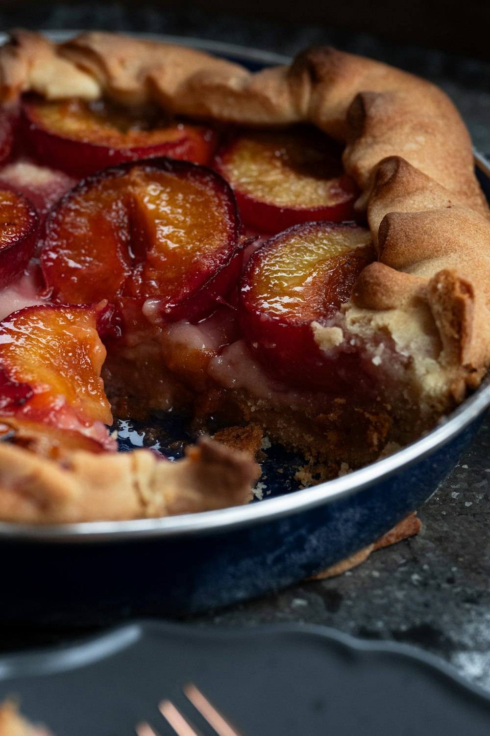 a close up of a pie in a pan on a table