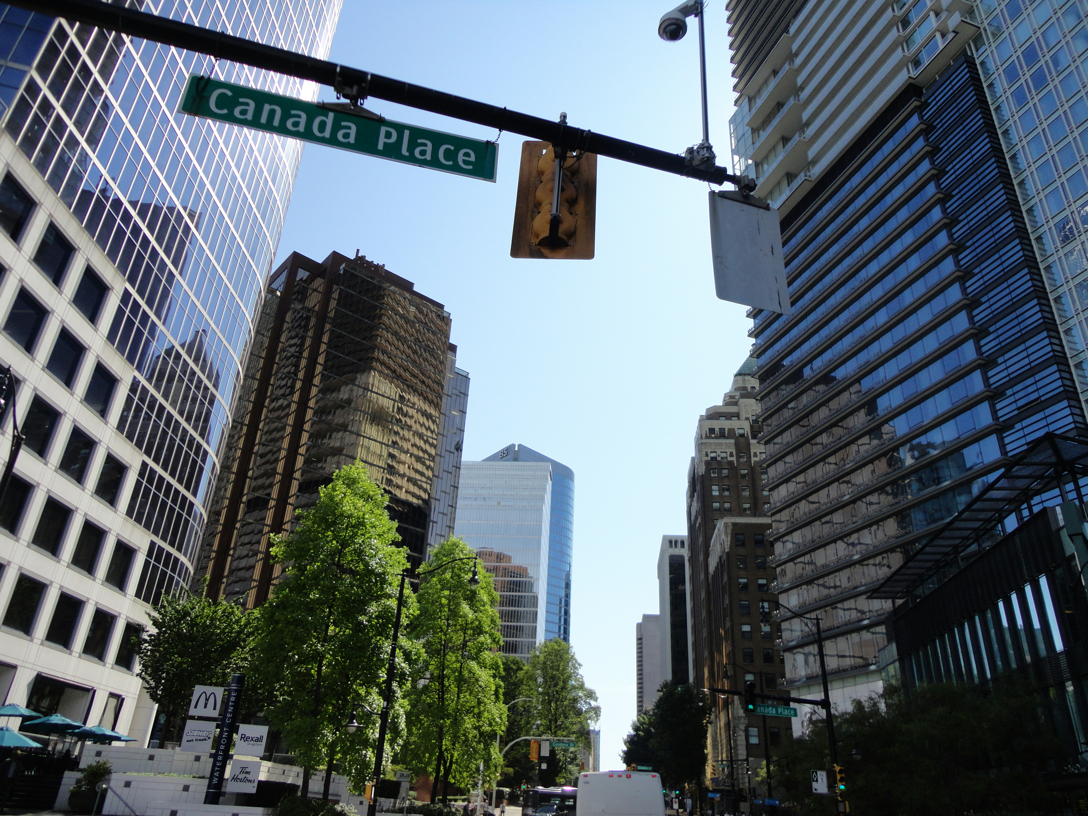 a street sign hanging from the side of a traffic light