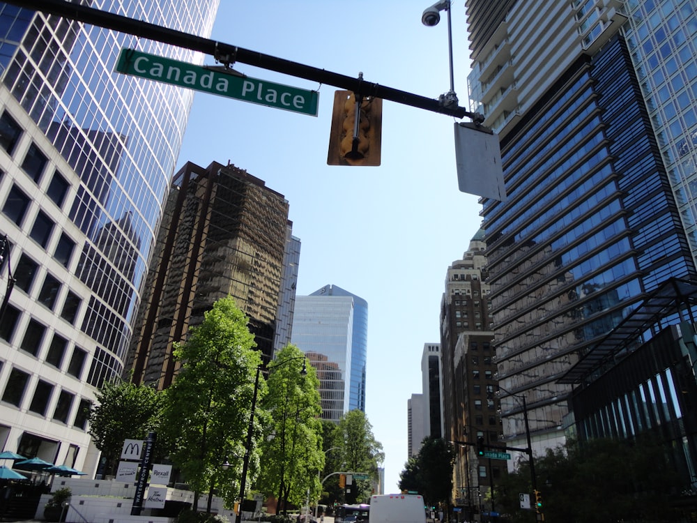 a street sign hanging from the side of a traffic light