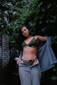 A model wearing eco-friendly clothing in a natural setting.