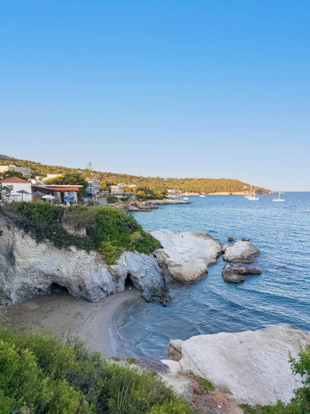 a view of a beach from a cliff