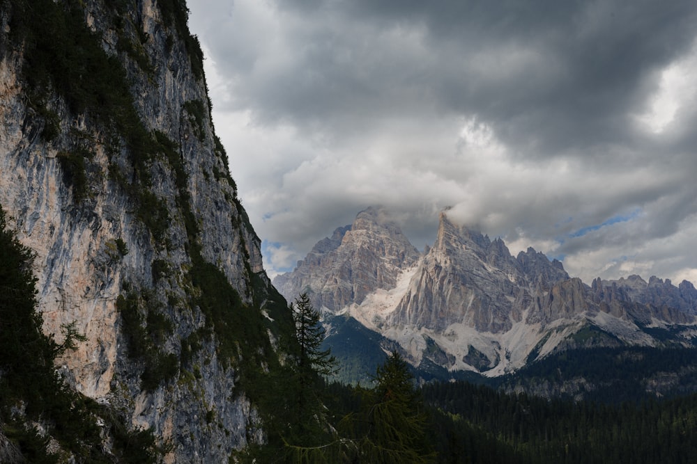 a view of a mountain range with clouds in the sky