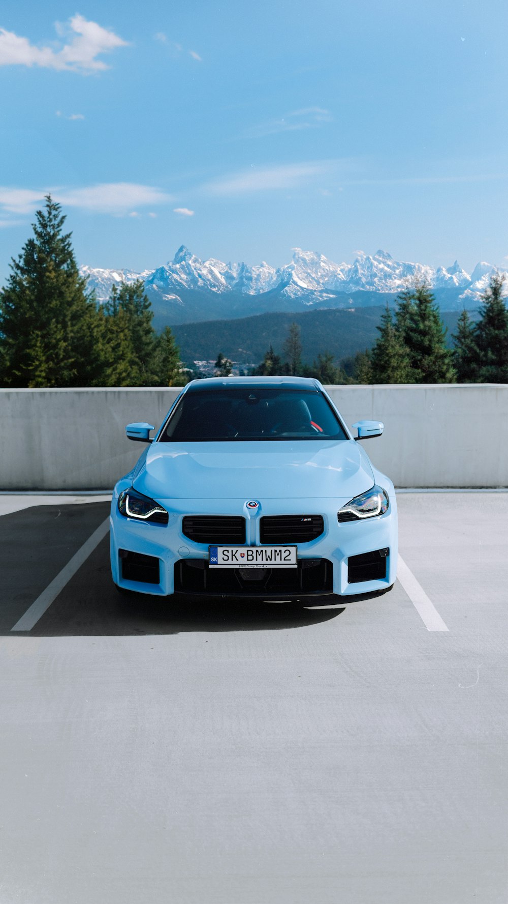 a blue car parked in a parking lot