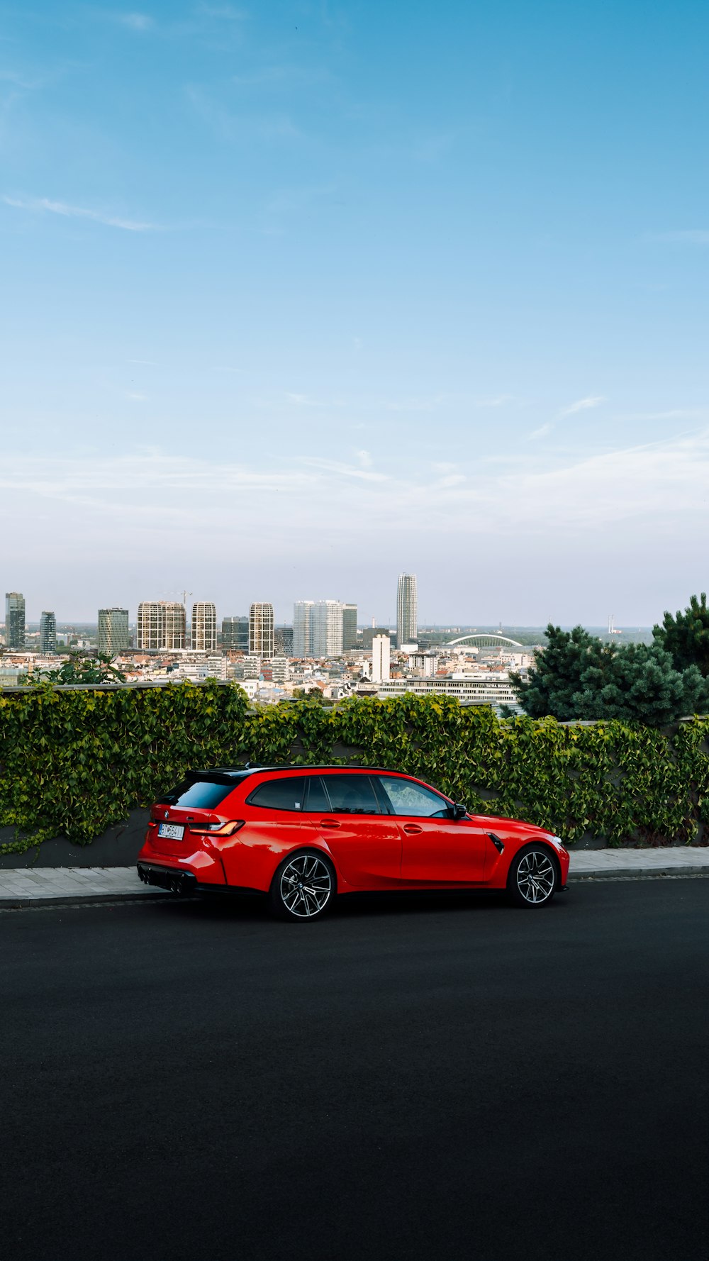 a red car parked on the side of the road