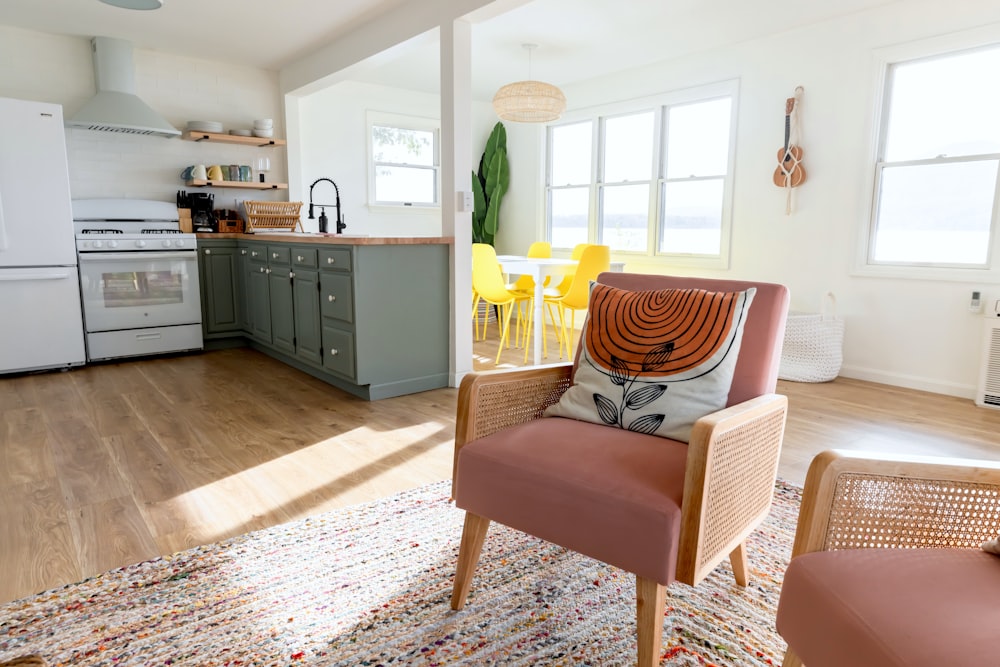 a living room with a couch a chair and a stove