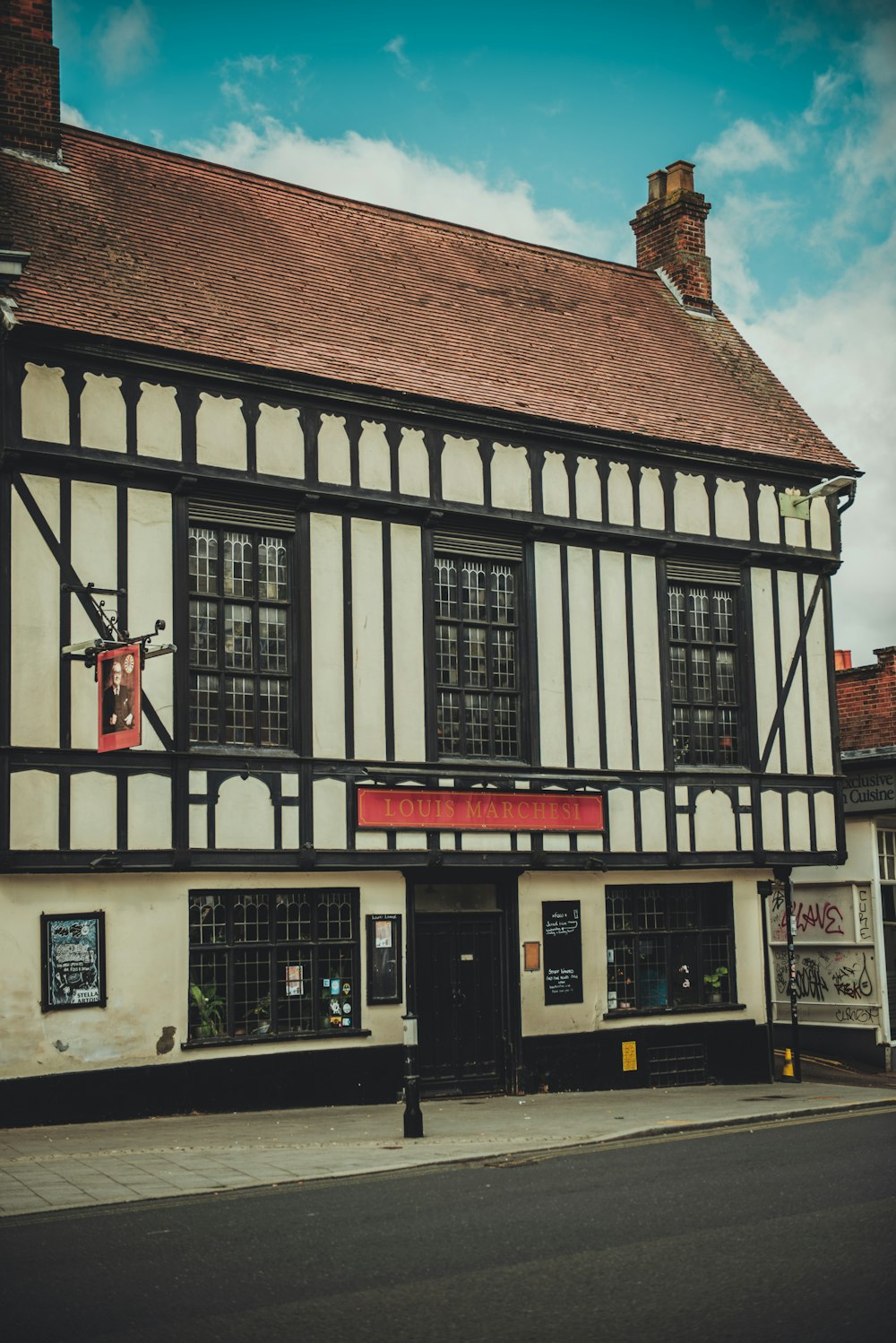 an old building with a black and white facade