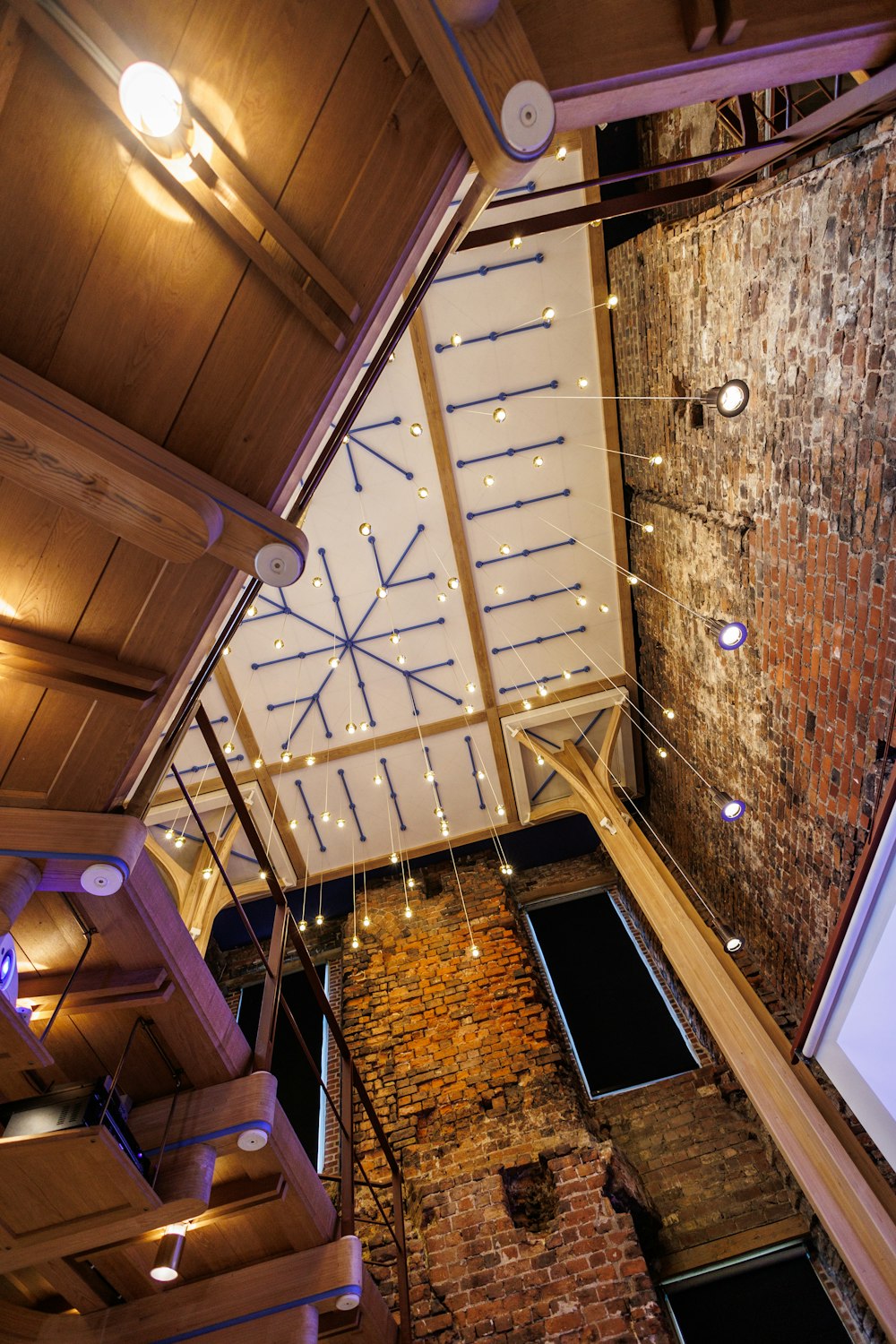 an overhead view of a brick building with a projector screen