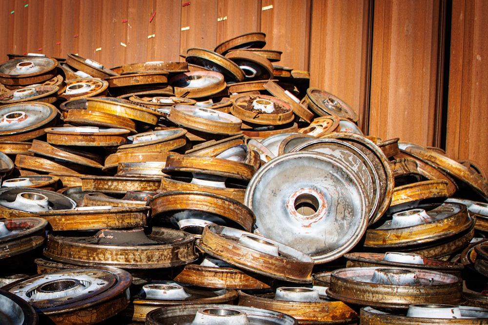 a pile of old tires sitting next to a building