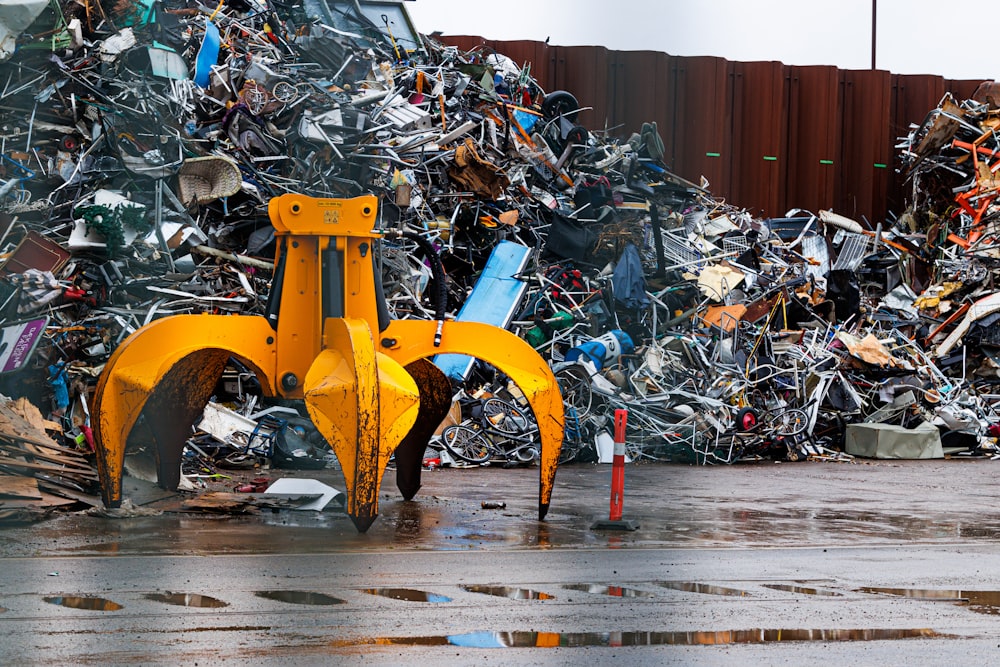 a pile of scrap metal sitting next to a building