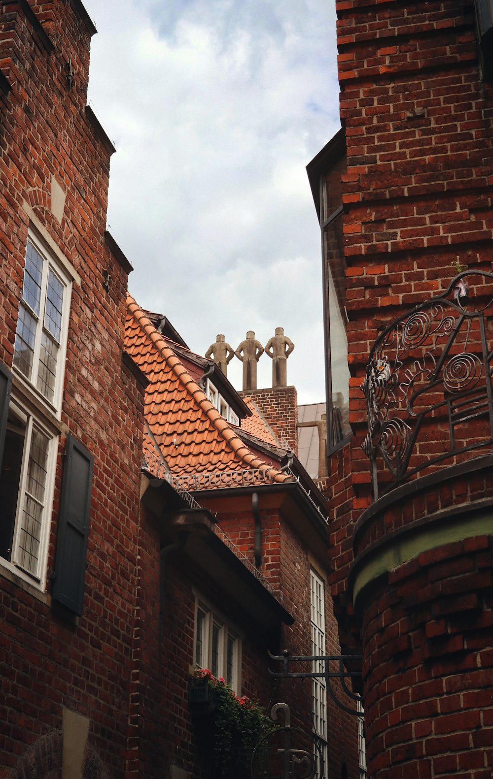 a brick building with two crosses on top of it