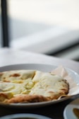 A close-up of freshly baked naan bread served with chutney.