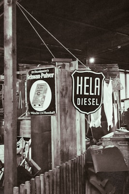 A vintage gas station sign with a bohemian twist, showcasing thrifted items.