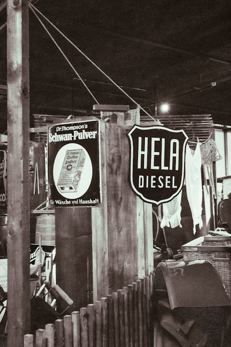 A vintage gas station sign with a bohemian twist, showcasing thrifted items.
