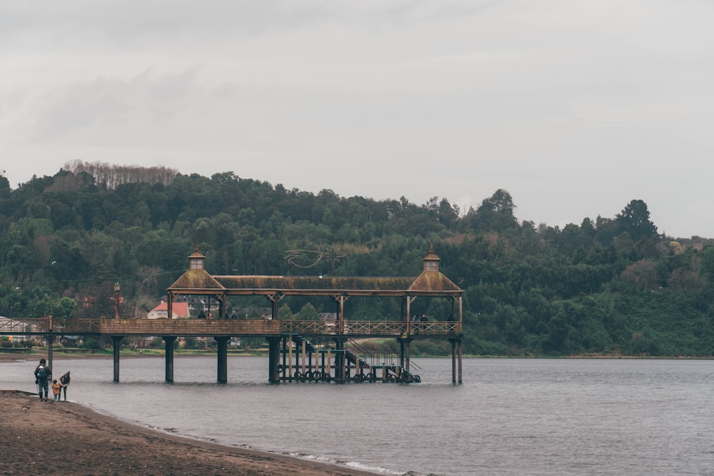 a pier on the shore of a lake