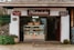 a store front with baskets of food on display