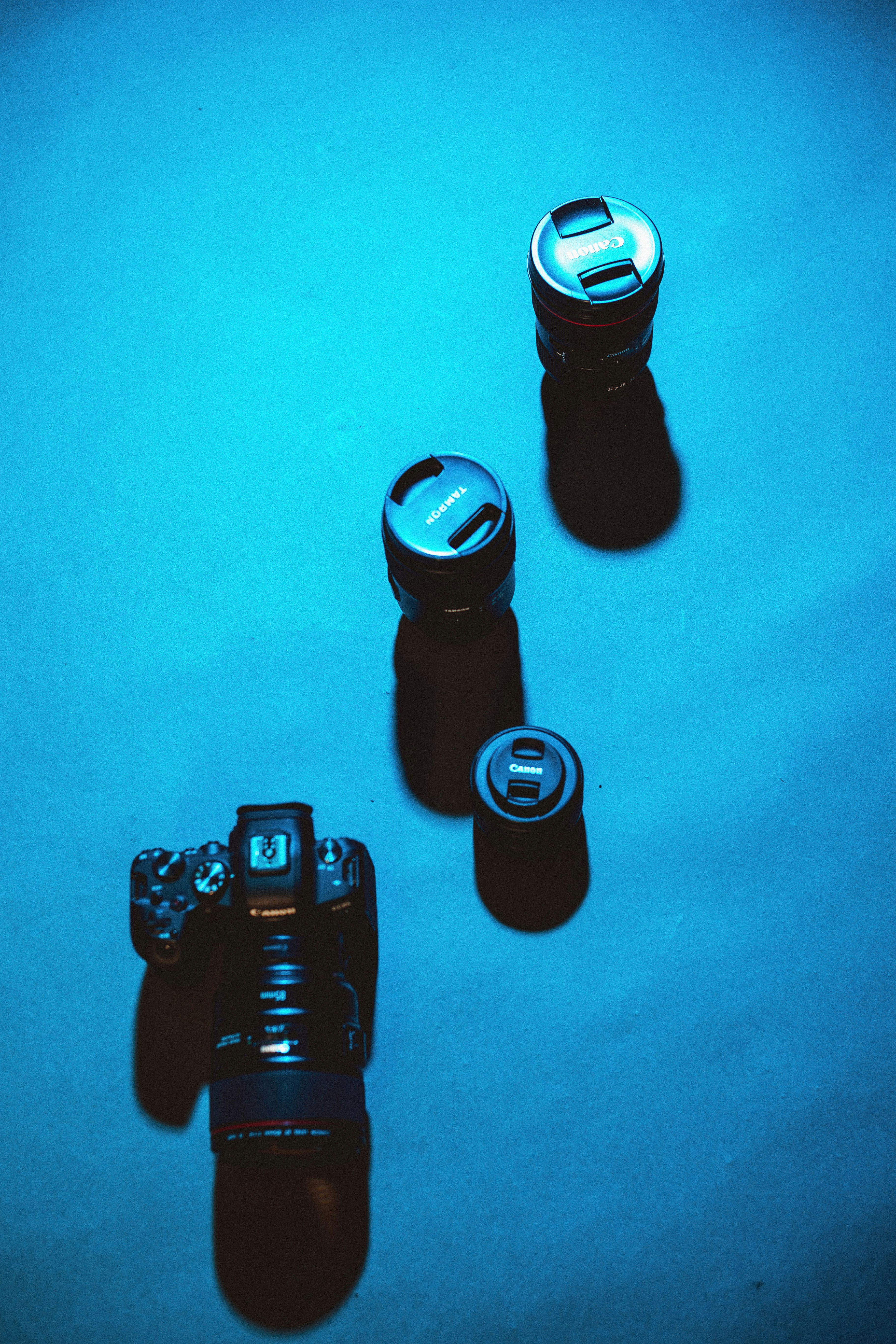 a camera and a can of soda on a table