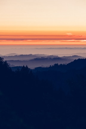 Scenic view of the lush green hills surrounding Nagari Sitombol Padang Gelugur at sunrise