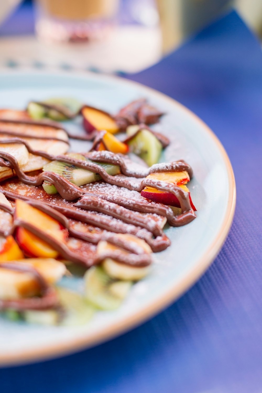 a white plate topped with sliced up fruit