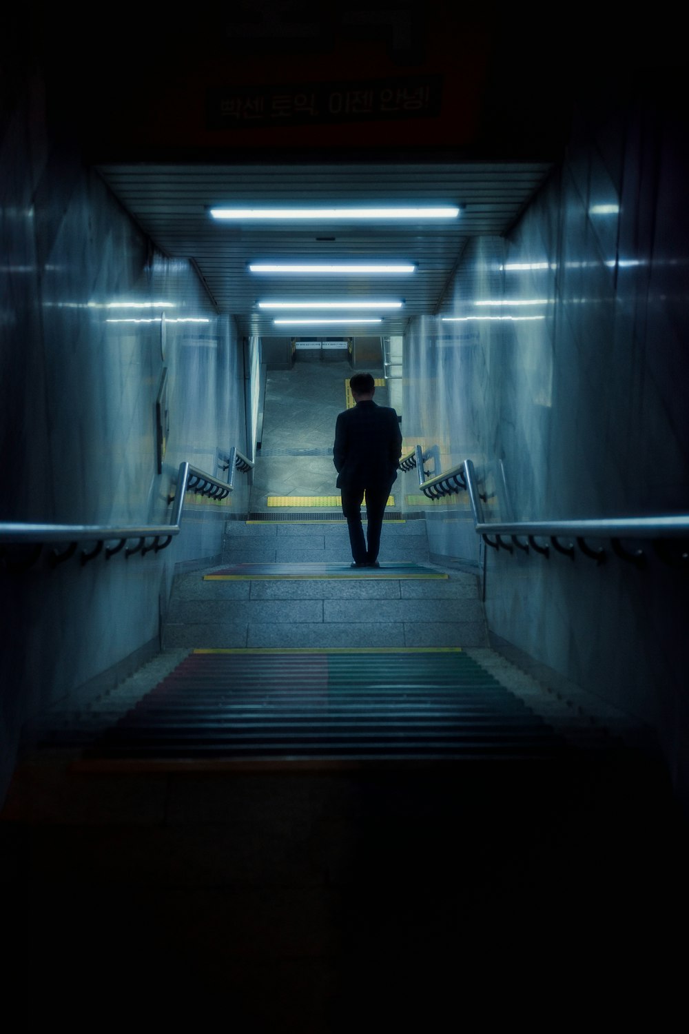 a man walking down a flight of stairs