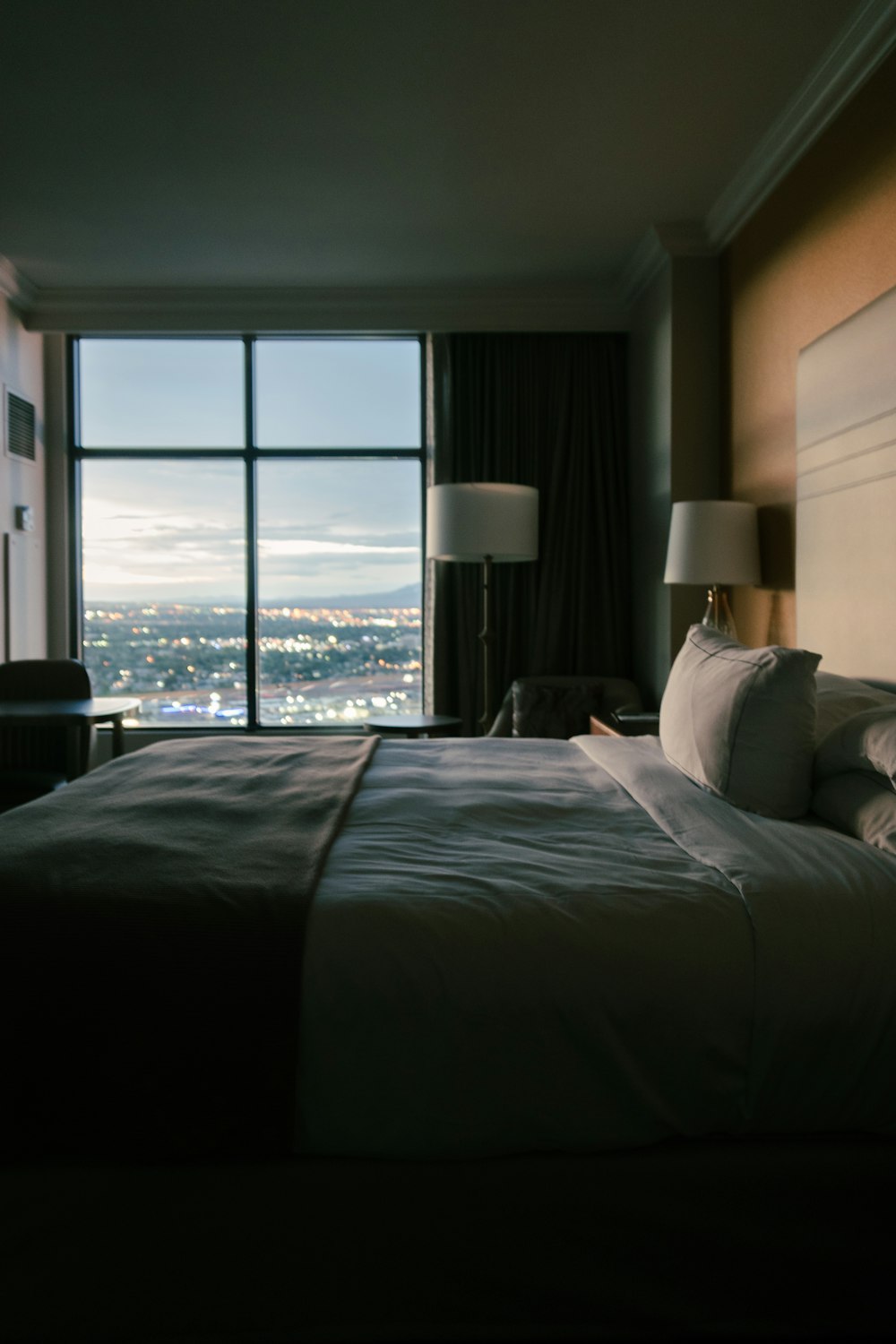 a hotel room with a view of the city