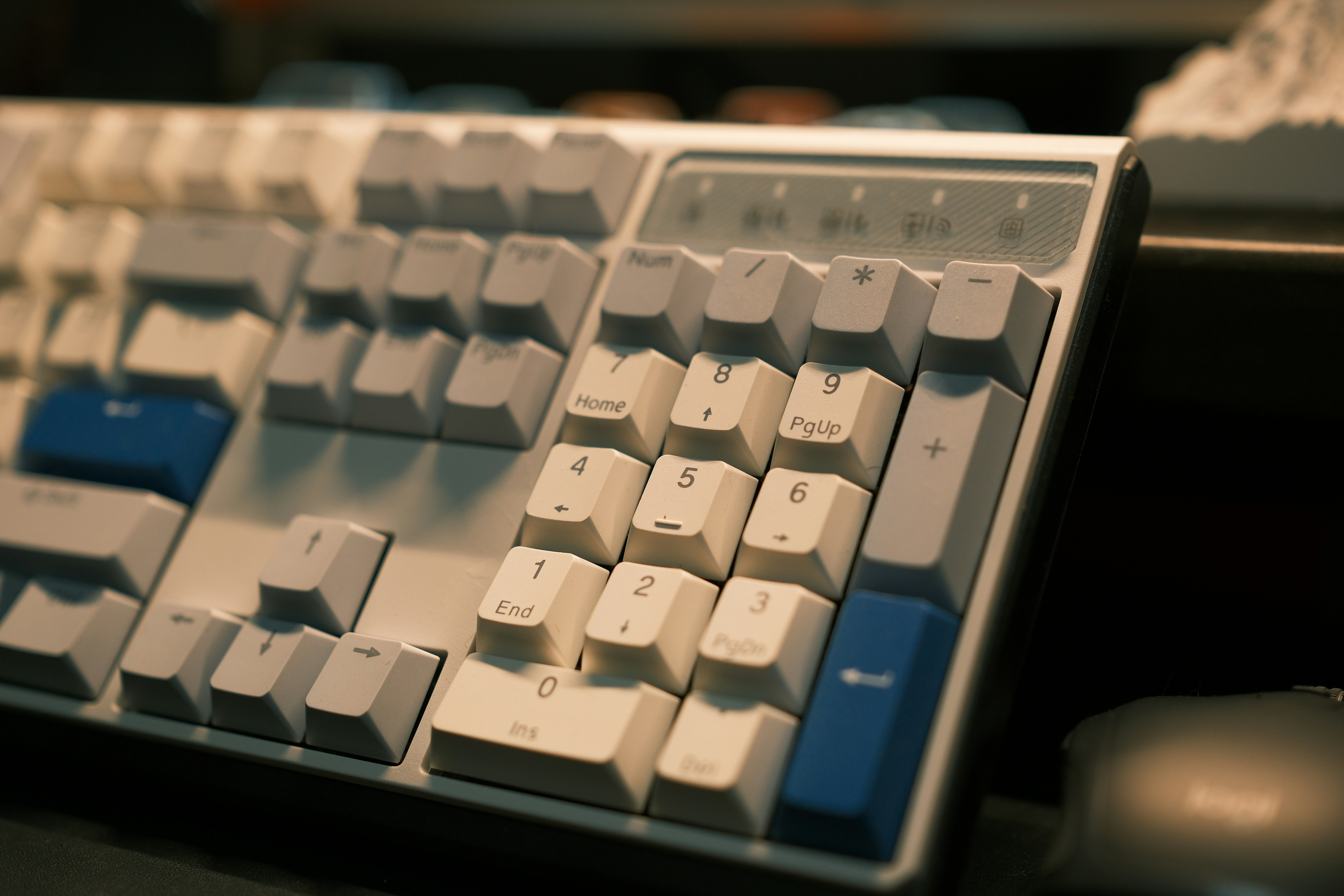 a computer keyboard sitting on top of a desk