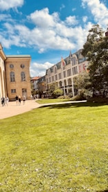 Historic Civil War battlefield with visitors exploring the grounds under a bright sky.