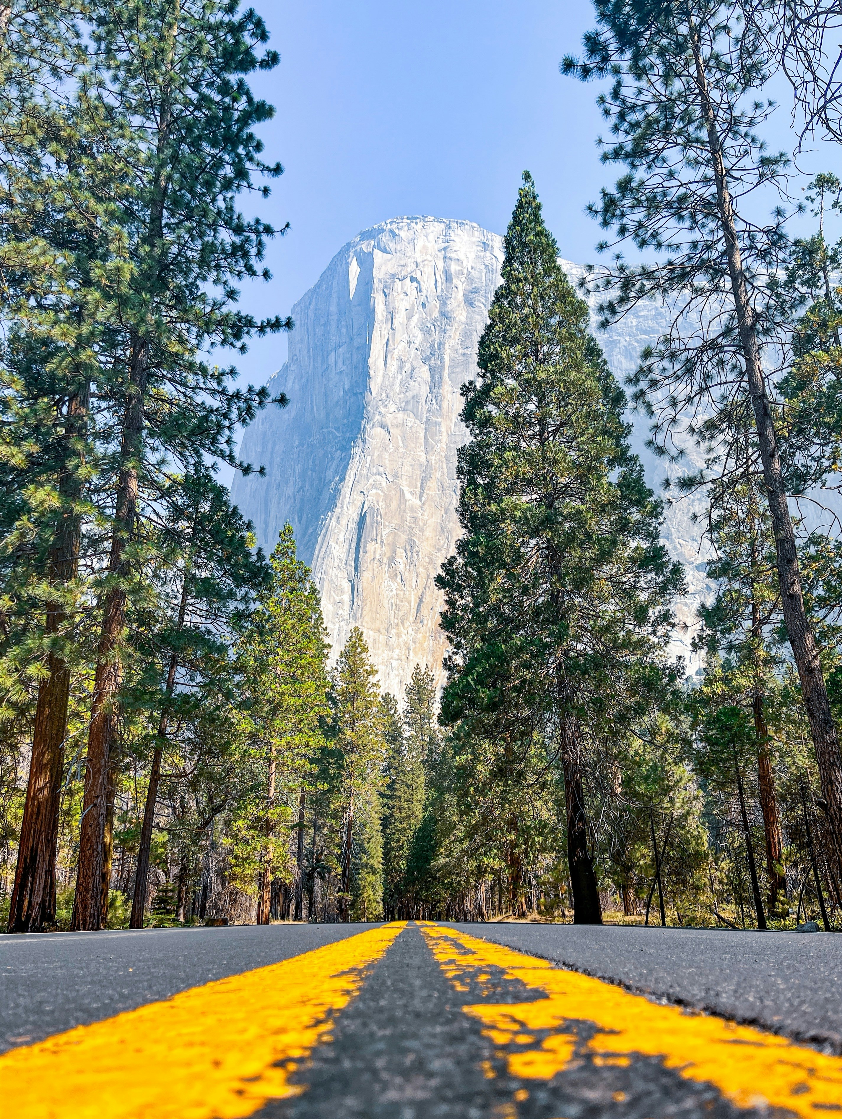 a road with a mountain in the background