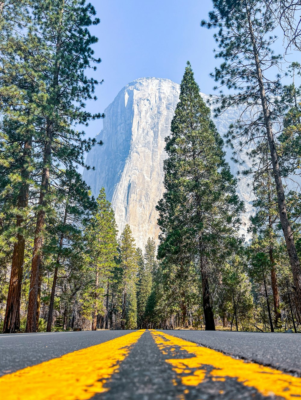 a road with a mountain in the background