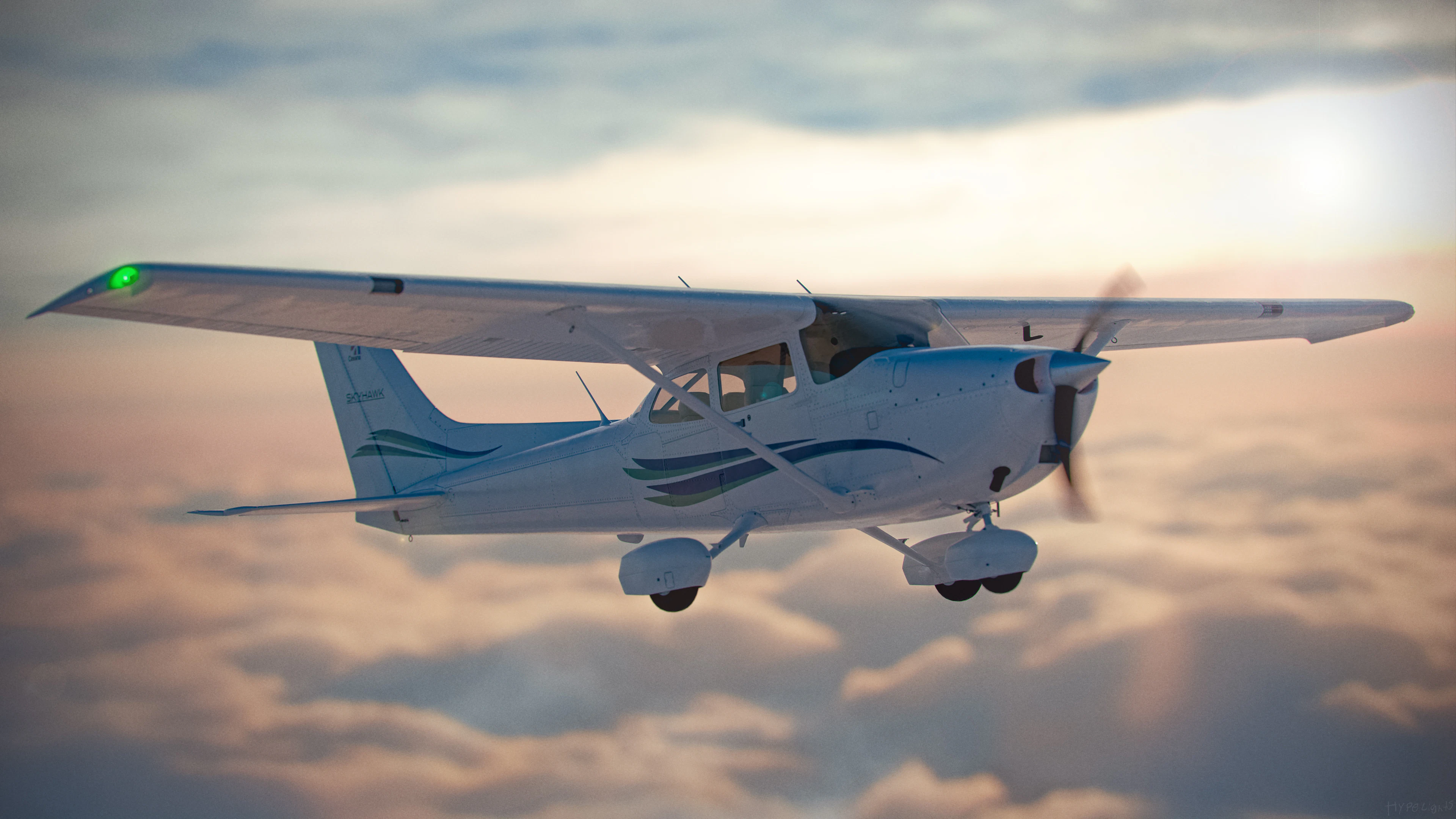 A blue and white Cessna in flight above the clouds
