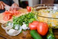 Fresh ingredients laid out neatly on a wooden table ready for preparation.