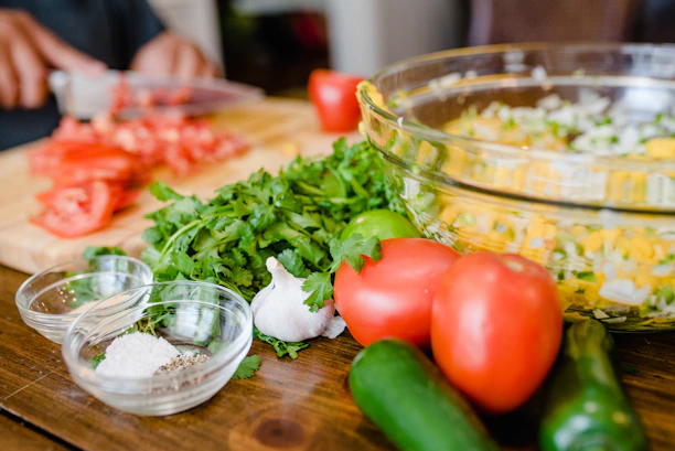 Close-up of fresh, simple ingredients for a healthy homemade meal on a wooden table.