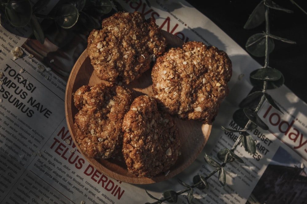 a plate of cookies sitting on top of a newspaper