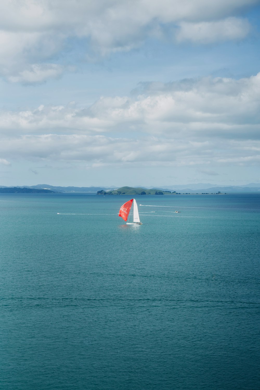 a sailboat in the middle of a large body of water