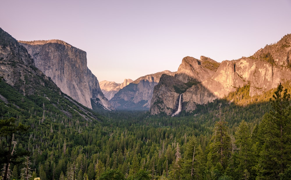 a view of a valley with mountains in the background