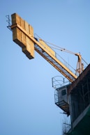 a crane is attached to the side of a building