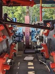 Factory scene showing vacuum compression packaging process for sofas.